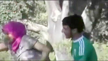 Dressed Arab mom bends by the tree to get fucked hard in the woods