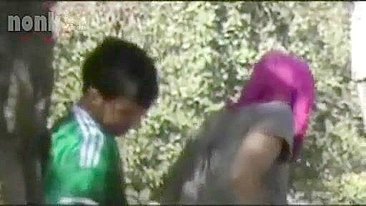 Dressed Arab mom bends by the tree to get fucked hard in the woods