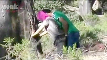 Dressed Arab mom bends by the tree to get fucked hard in the woods