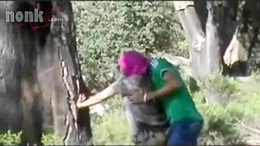 Dressed Arab mom bends by the tree to get fucked hard in the woods