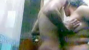 Horny guy sticks dick into fat Arab mom's vagina in the bathroom