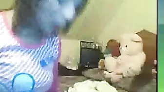 Arab webcam mom smokes and demonstrates her perky breasts on cam