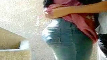 Big-assed Arab chick does her best to suck lover's cock outdoors