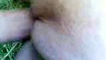 Close-up video of mature mom taking dick into shaved twat outdoors