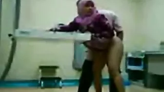 Dirty Arab gynecologist fucks cute mom from behind in the cabinet