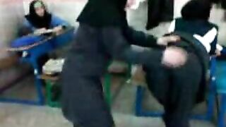 Several Arab girls in hijab play naughty games in the classroom