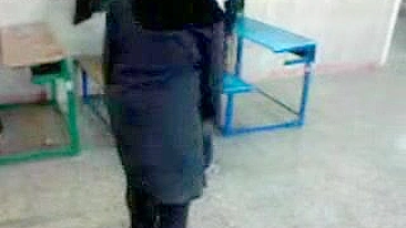 Several Arab girls in hijab play naughty games in the classroom