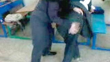 Several Arab girls in hijab play naughty games in the classroom