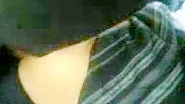 Horny Arab mom strokes her man's dick before car sex in public place