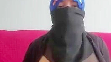 Steamy Arab mom uses toy in her cunt while posing in hijab