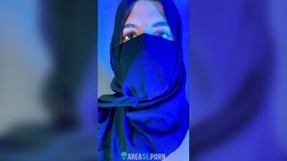 Muslim mistress wife in hijab putting a condom on big strapon