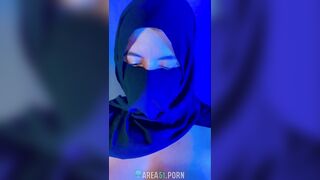 Muslim mistress wife in hijab putting a condom on big strapon