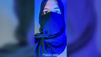 Muslim mistress wife in hijab putting a condom on big strapon