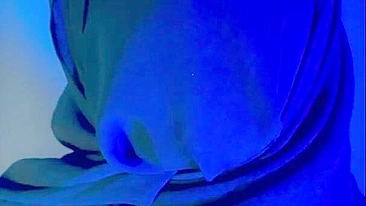 Muslim mistress wife in hijab putting a condom on big strapon