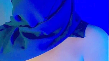 Muslim mistress wife in hijab putting a condom on big strapon