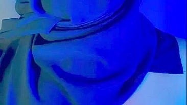 Muslim mistress wife in hijab putting a condom on big strapon