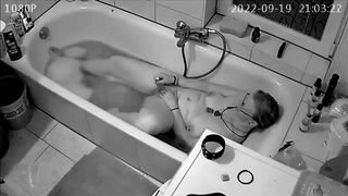 Son 'installs spy cam and catches mom masterbating in the tub while sexting with husband