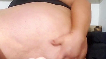 This is a video of a mother showing off her tits and fucking her stepson