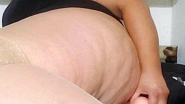 This is a video of a mother showing off her tits and fucking her stepson