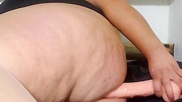 This is a video of a mother showing off her tits and fucking her stepson