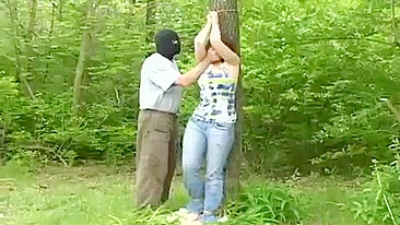 Busty girl kidnapped tied up and fucked in the woods, against her will