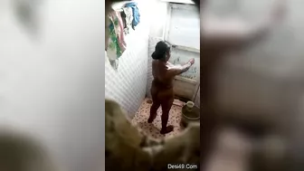 Hidden camera captures horny village aunty full nude bathing. Desi XXX video