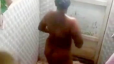 Hidden camera captures horny village aunty full nude bathing. Desi XXX video