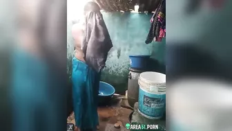 Desi XXX MMS, an older topless village aunt is caught on camera bathing