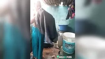 Desi XXX MMS, an older topless village aunt is caught on camera bathing