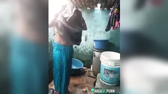 Desi XXX MMS, an older topless village aunt is caught on camera bathing