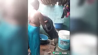 Desi XXX MMS, an older topless village aunt is caught on camera bathing