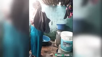 Desi XXX MMS, an older topless village aunt is caught on camera bathing