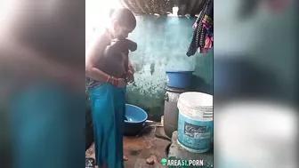 Desi XXX MMS, an older topless village aunt is caught on camera bathing