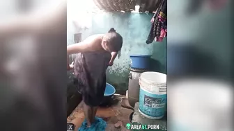 Desi XXX MMS, an older topless village aunt is caught on camera bathing