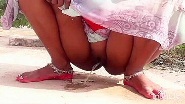XXX video Indian aunty pissing outdoor and i see her hot pussy