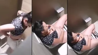 Hidden cam caught Indian aunty fingering in public bathroom Hidden cam caught Indian aunty fingering in public bathroom