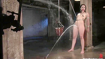 Water bondage with gagged brunette girl with shaved pussy
