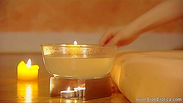 Petite young lady carefully gives her boyfriend oiled handjob in relaxing Oriental environment