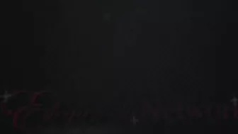 Elegant Indian model relaxes in the bath surrounded by candles