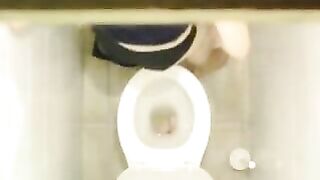 Sexy Young Student Caught in Public bathroom masturbating to porn magazine