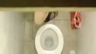 Sexy Young Student Caught in Public bathroom masturbating to porn magazine