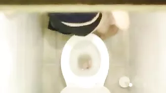 Sexy Young Student Caught in Public bathroom masturbating to porn magazine