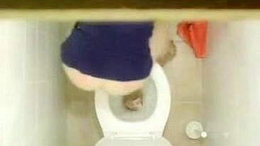 Sexy Young Student Caught in Public bathroom masturbating to porn magazine