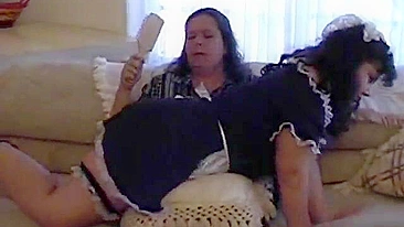 BDSM Scene with Mistress and Maid in Uniform, featuring spanking and blowjob