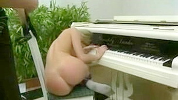 Strapping Teen Lesbians Get Their Asses Pounded on the Piano!