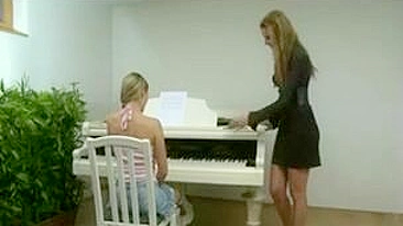 Strapping Teen Lesbians Get Their Asses Pounded on the Piano!