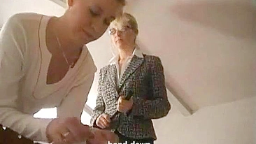 Lesbian Dominant Delivers Harsh Punishment to Submissive Partner in BDSM Scene.