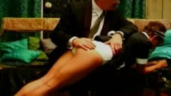 Spanking The Maid, a kinky fetish video featuring caning and spanking.