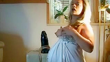 Pregnant Blonde MILF's Big Belly Gets a Thrill Riding a Monster Dildo