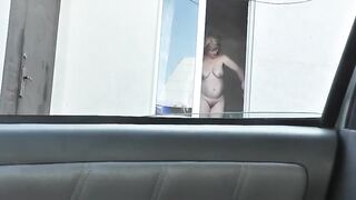 Spying from car on a neighbor who washes window completely naked,  public, voyeur